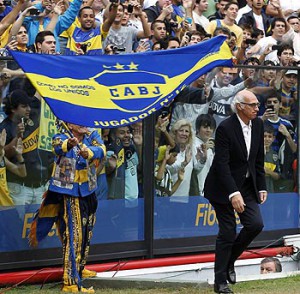 Newly appointed Boca Juniors' soccer team coach Bianchi enters the pitch after signing a contract for three seasons in Buenos Aires