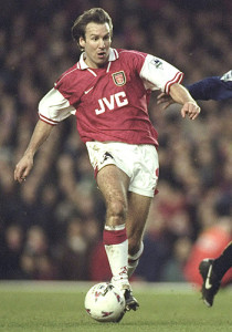 Paul Merson of Arsenal challenged by Robbie Earle